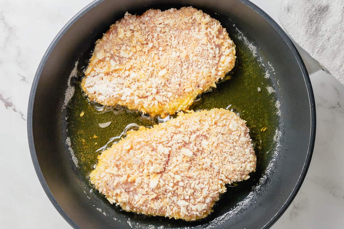 crispy chicken frying in the pan