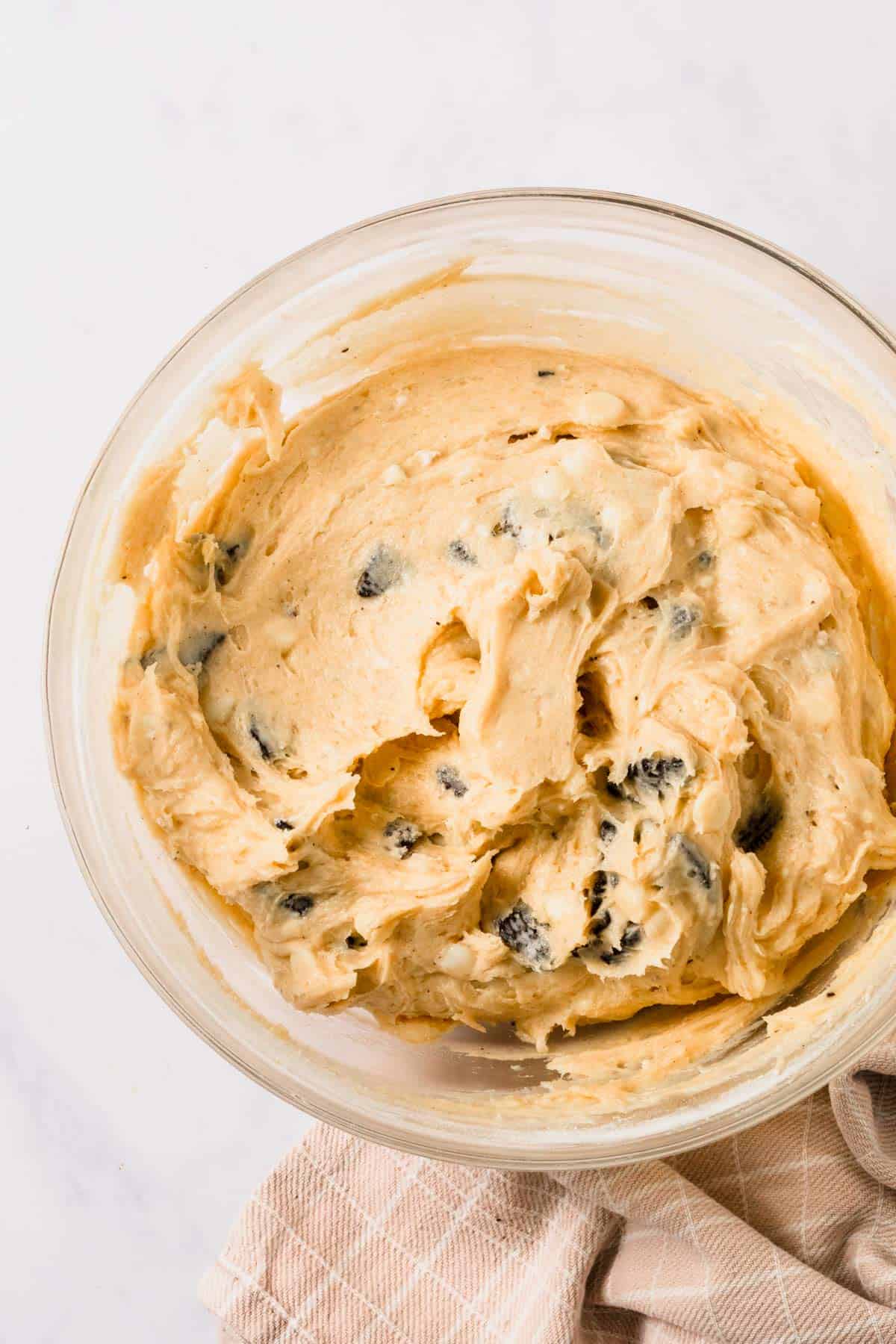 cookies and cream cookie batter ready for baking in a bowl