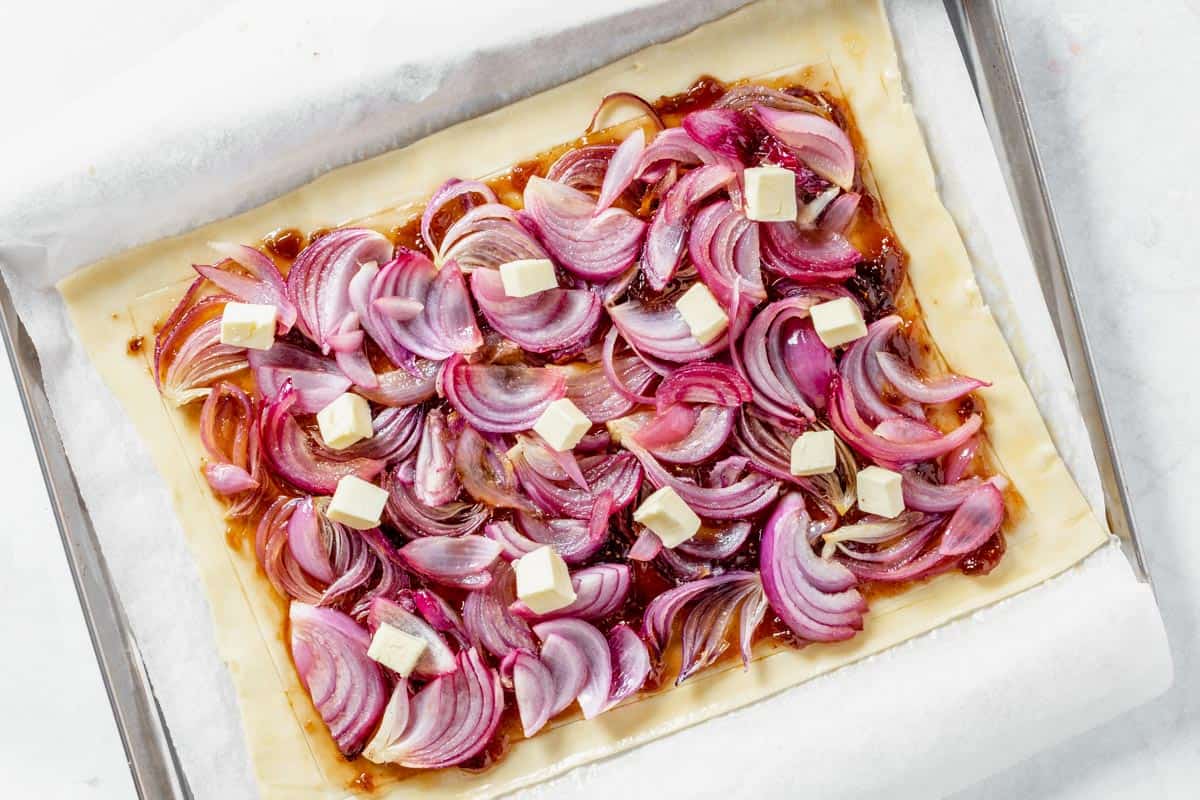 sauteed red onions and butter on top of fig jam
