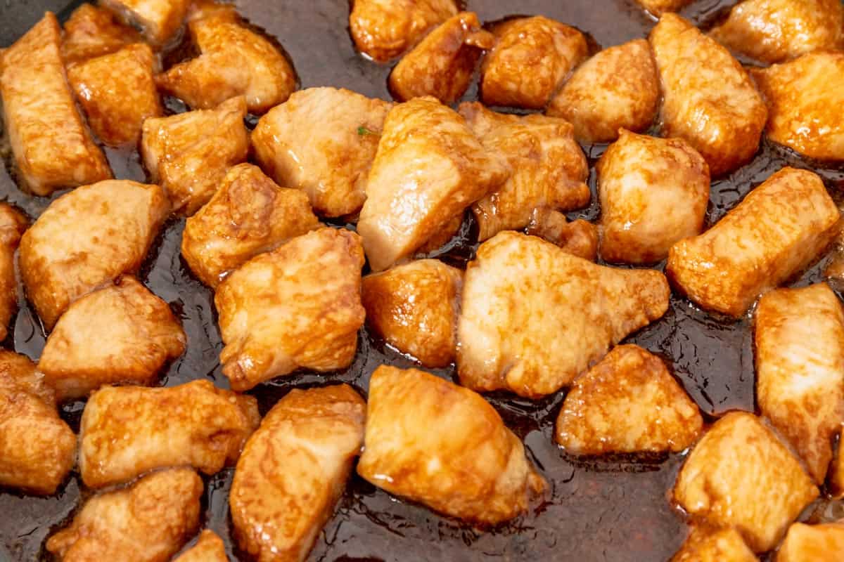 chicken frying in teriyaki sauce