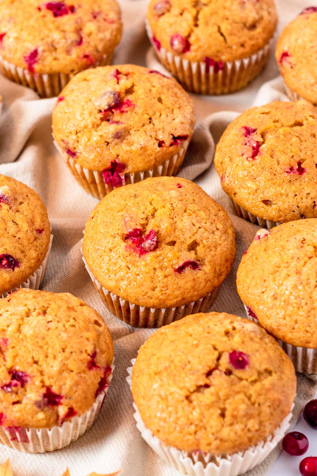 Pumpkin Muffins With Cranberries on towel