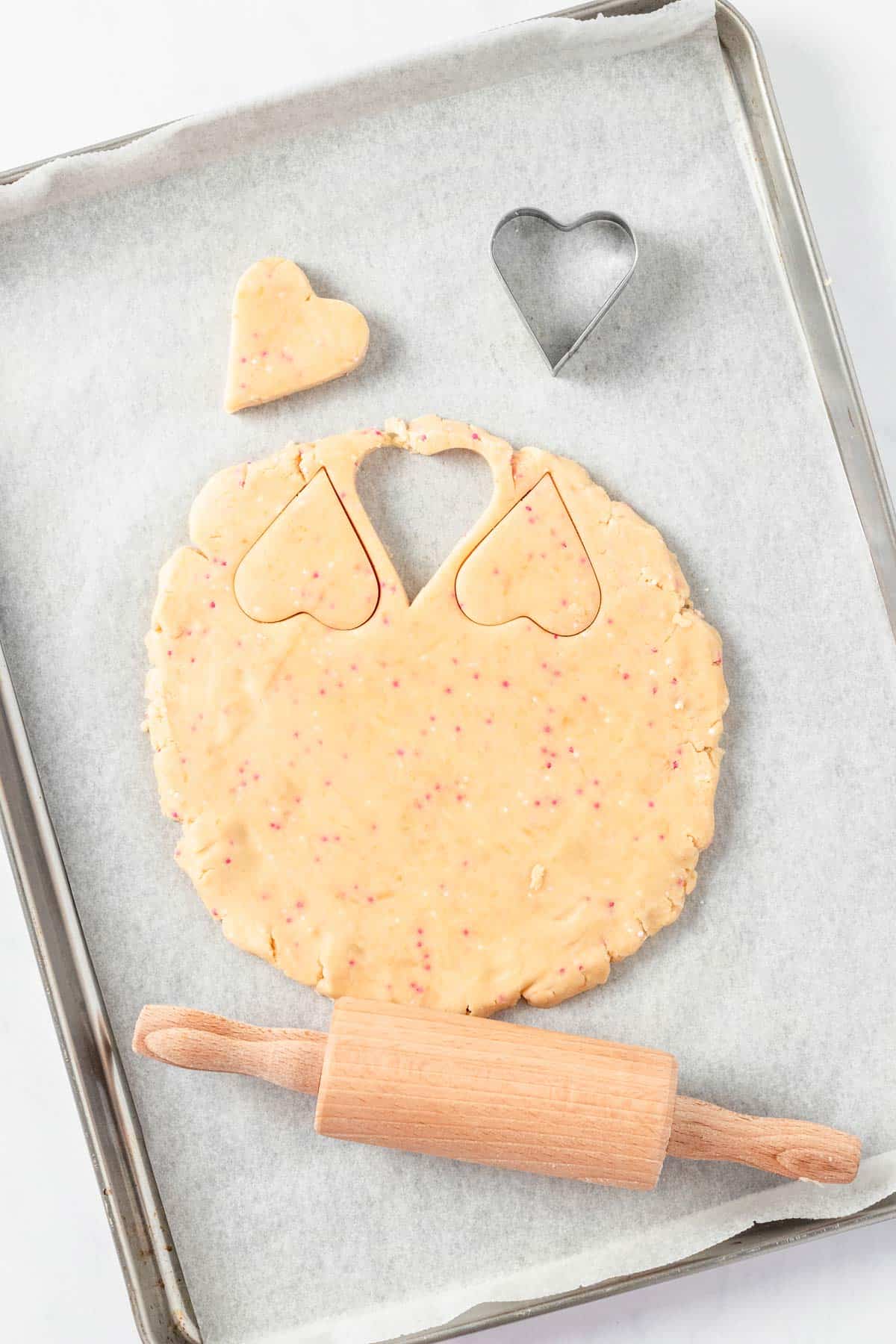 shortbread cookie batter with heart shaped cookie cutter