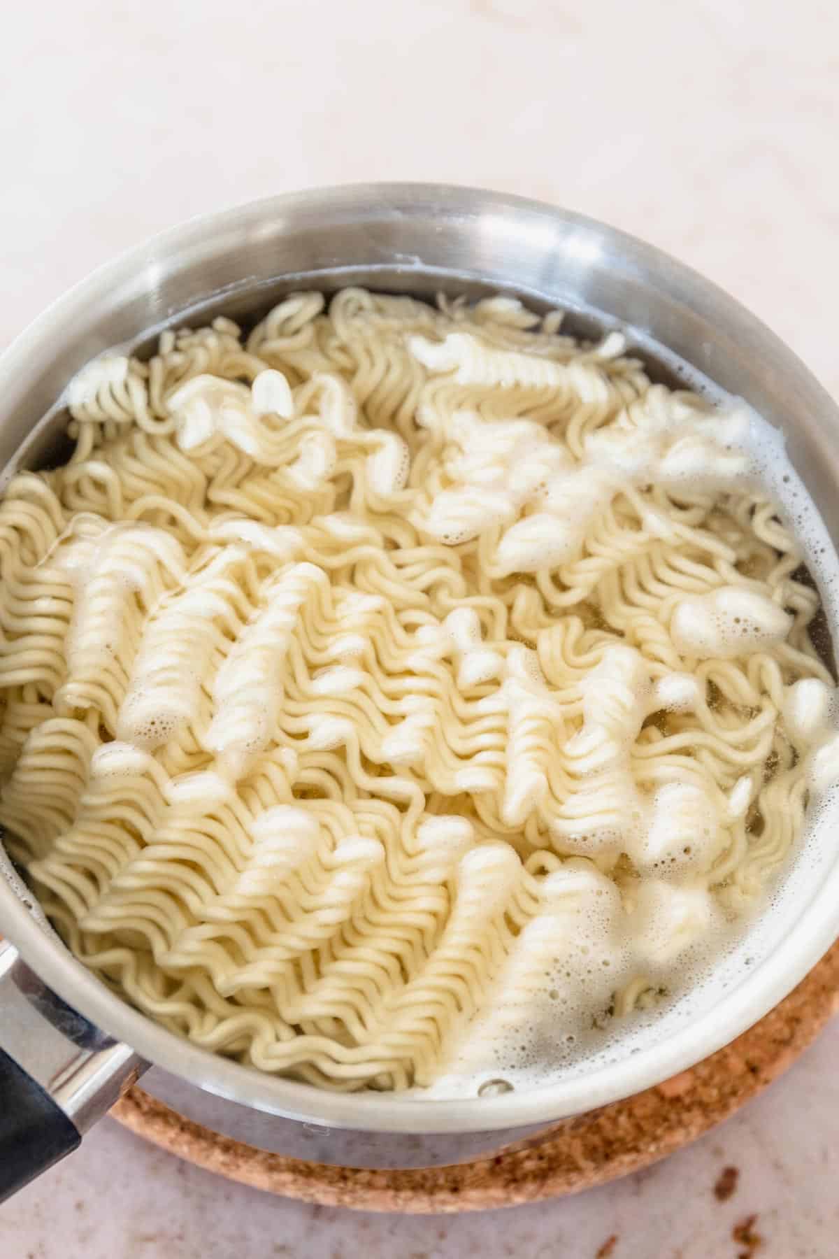 ramen noodles in colander with water