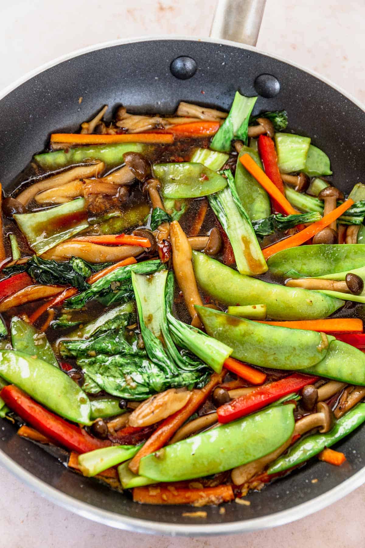 vegetables for ramen frying in a pan