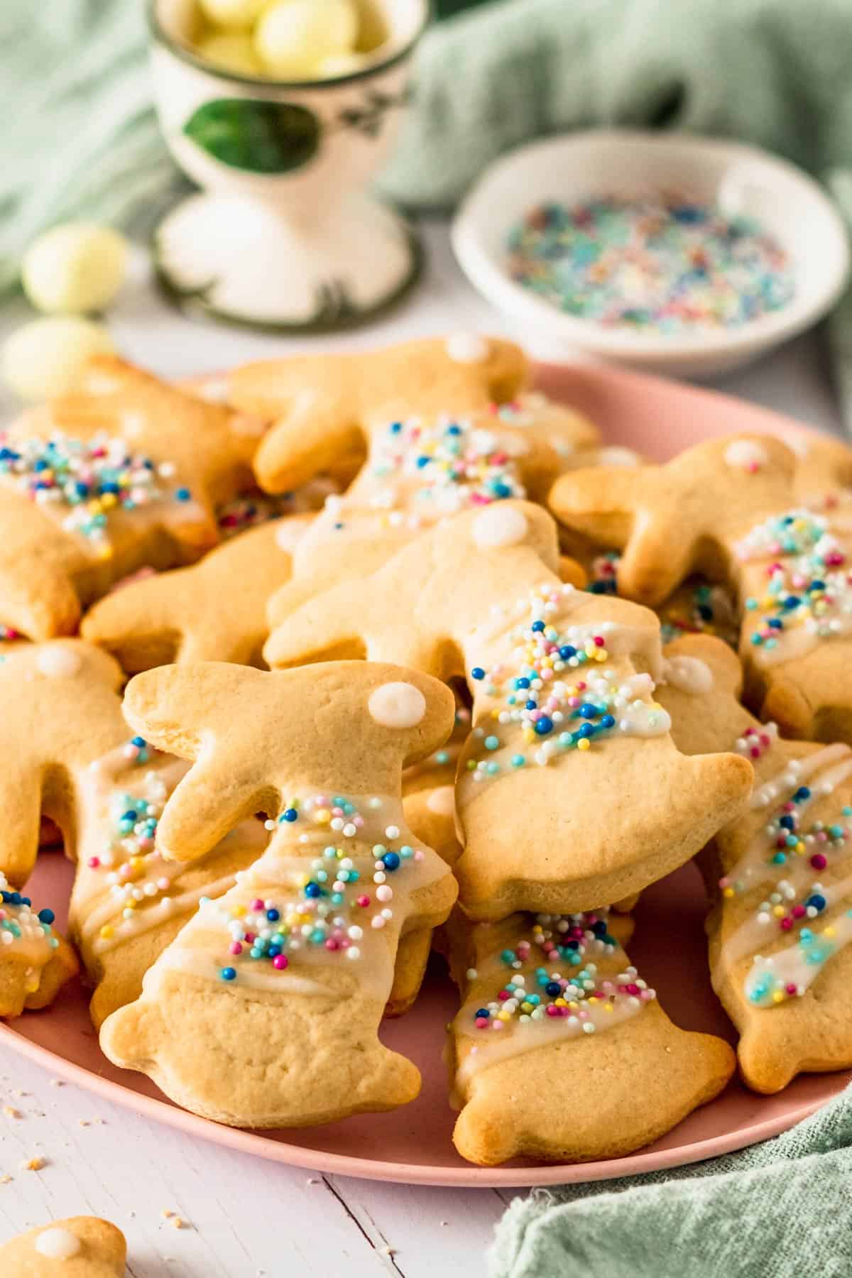Bunny shaped sugar cookies with icing on a pink plate