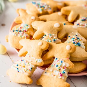 Bunny shaped sugar cookies with icing on a pink plate