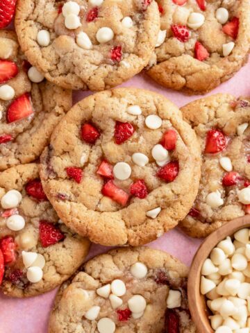 a stack of strawberry cookies with white chocolate chip cookies