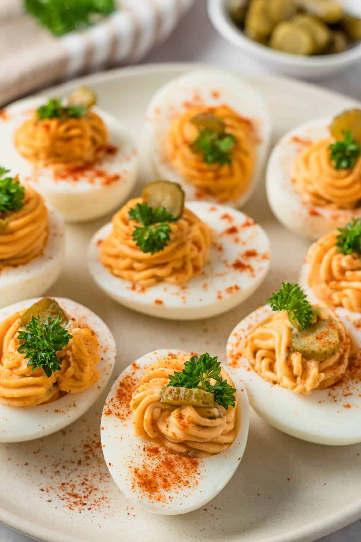 spicy deviled eggs with pickles hot sauce and paprika