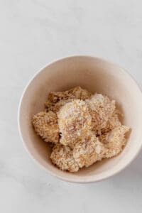 uncooked breaded panko chicken slices in a bowl