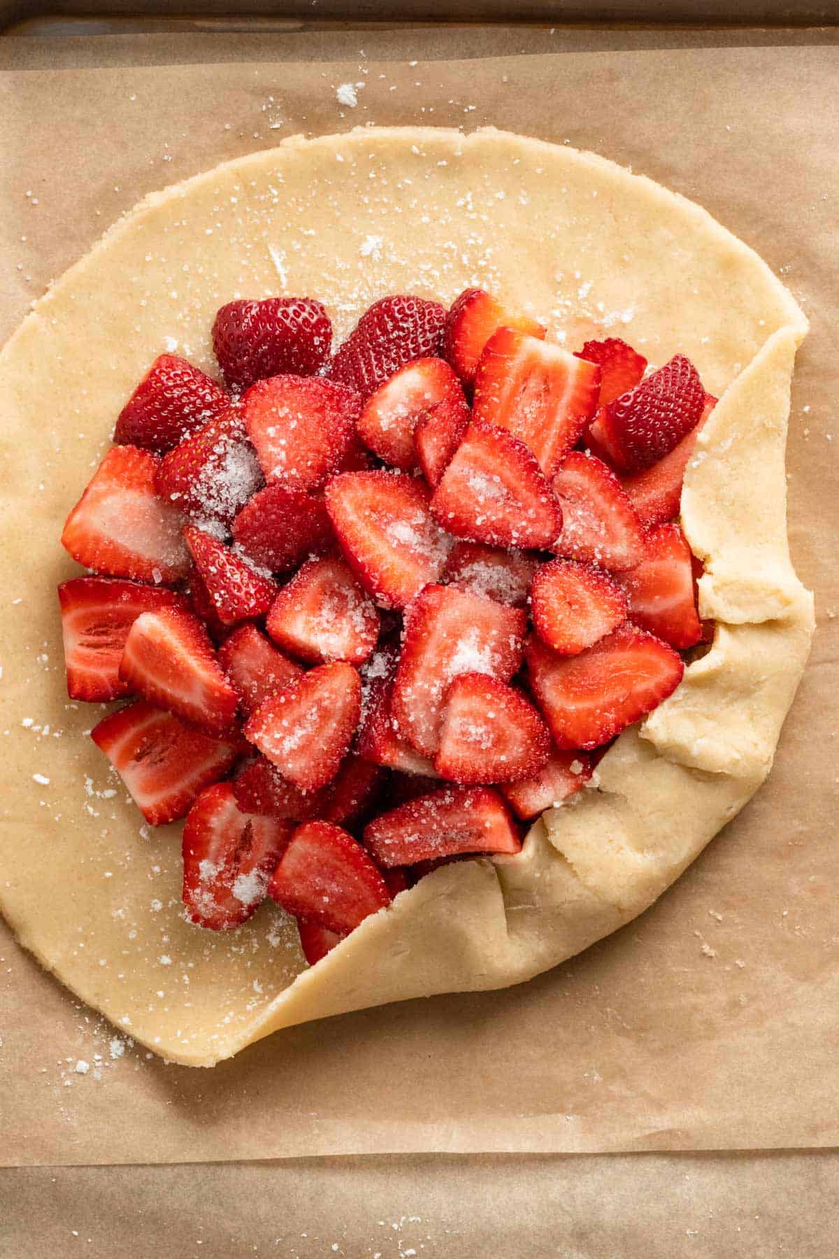 folding the edges for strawberry galette