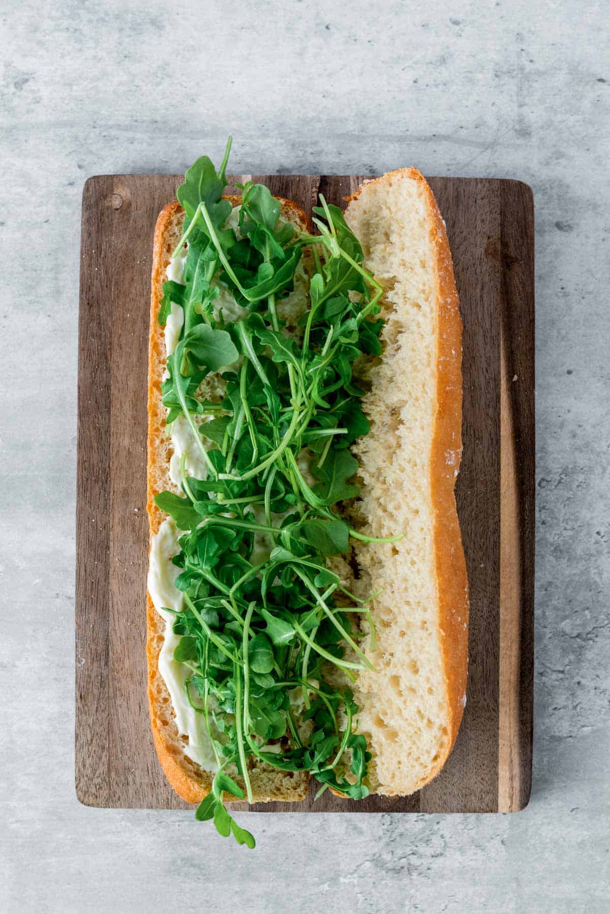 baguette topped with truffle mayo and fresh arugula
