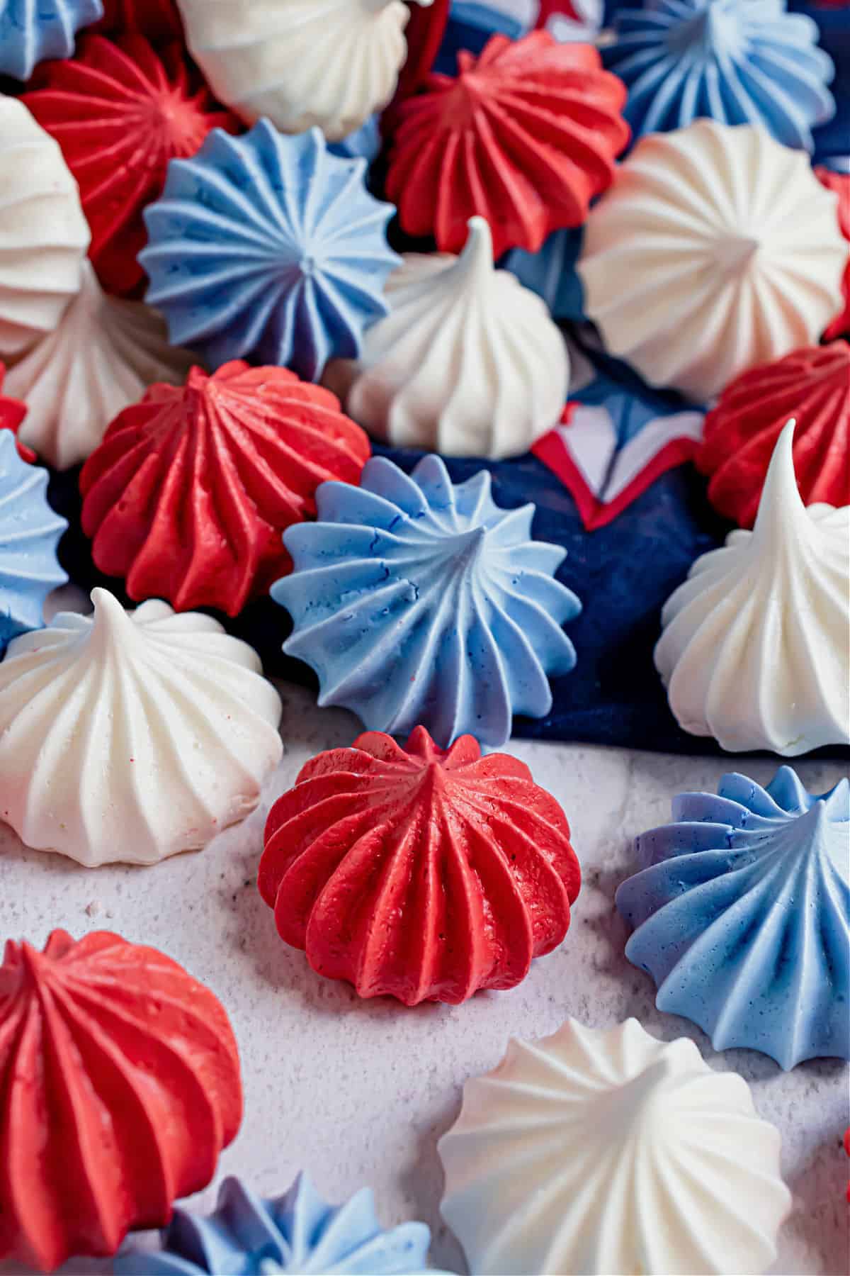 a stack of 4th of july meringues in star shape.