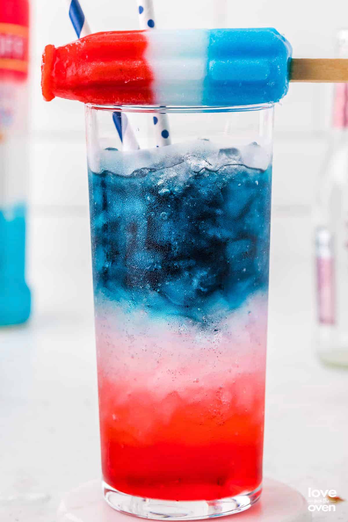 4th of july themed drink with layers of red, white and blue.