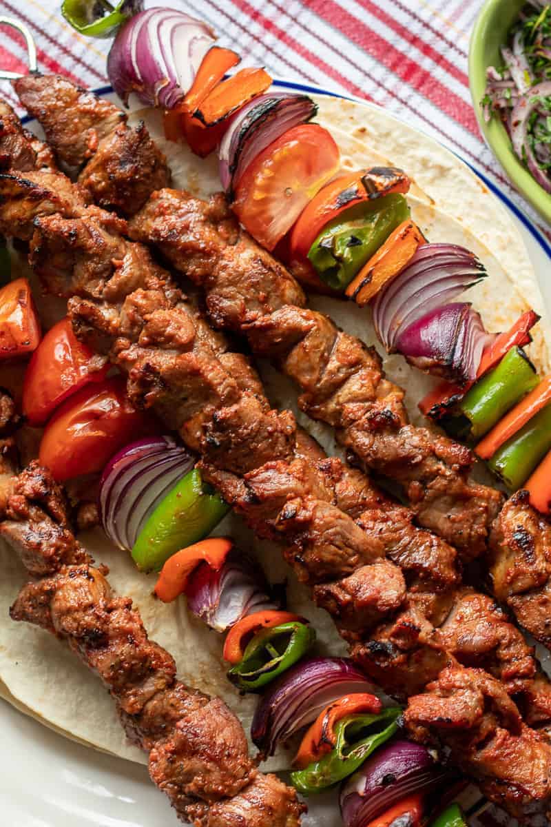 stack of lamb kebabs on skewers.