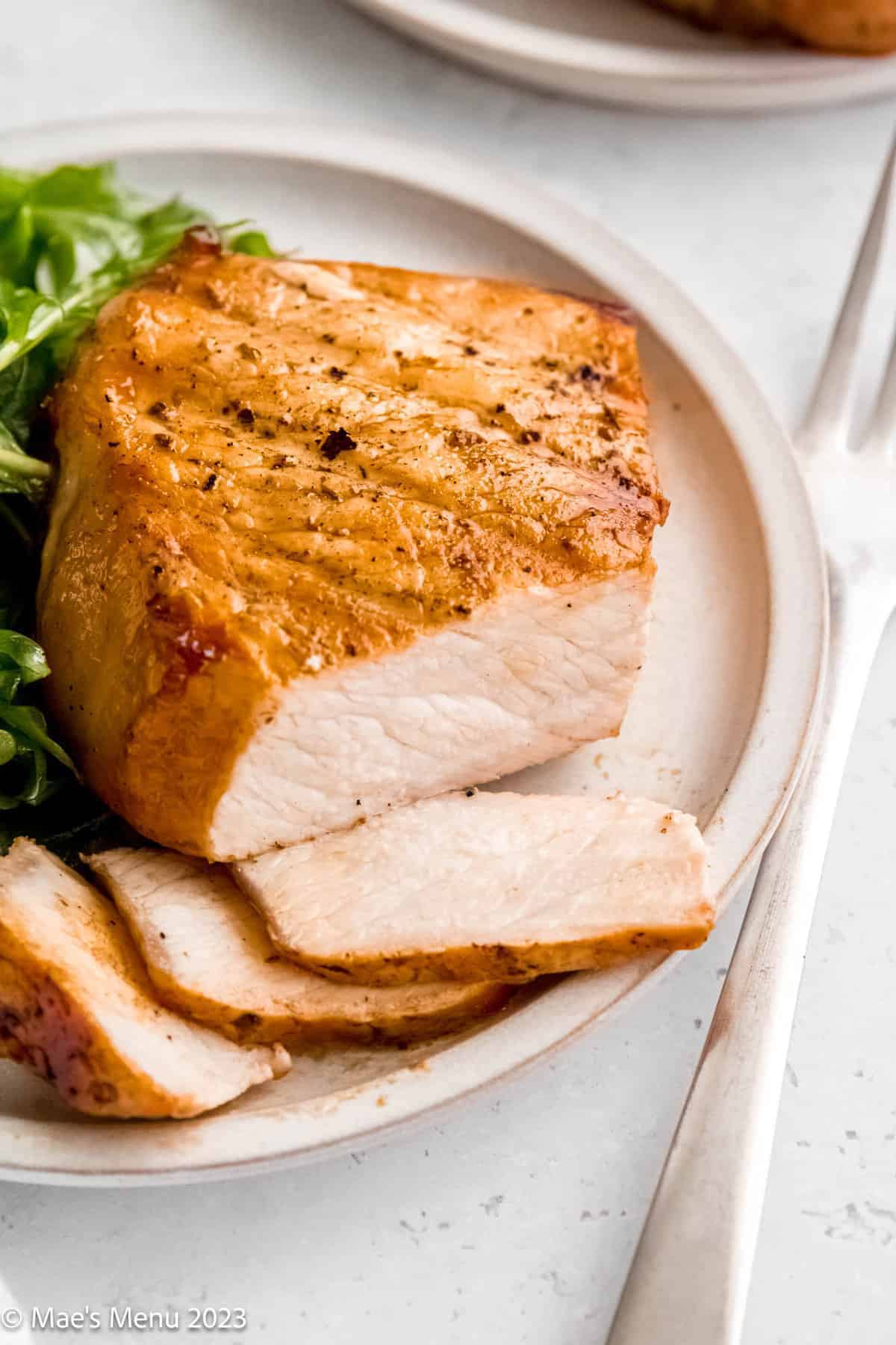 slices of pork chop on a plate.