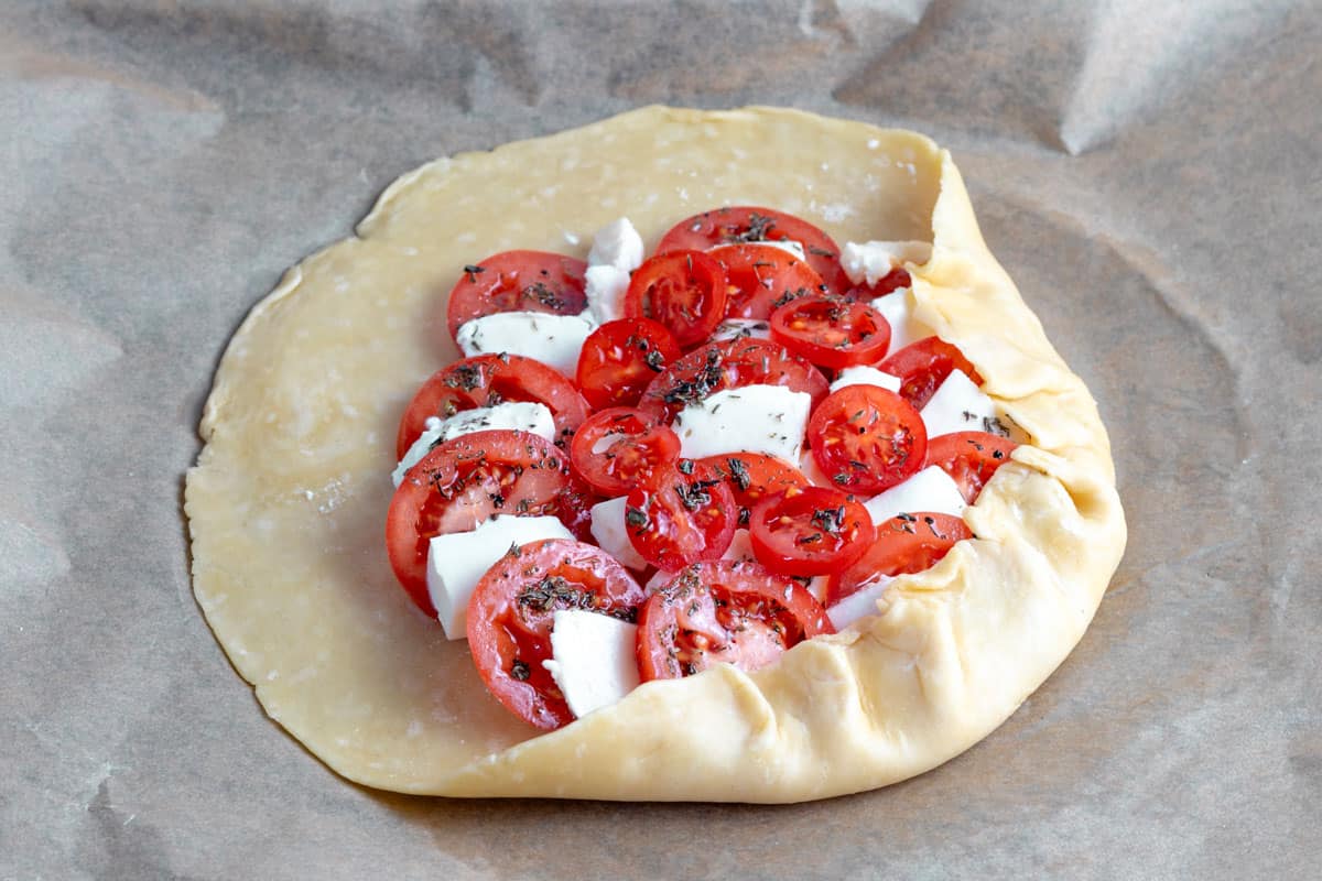 tomato filling with basil and mozzarella and seasoning added to galette dough