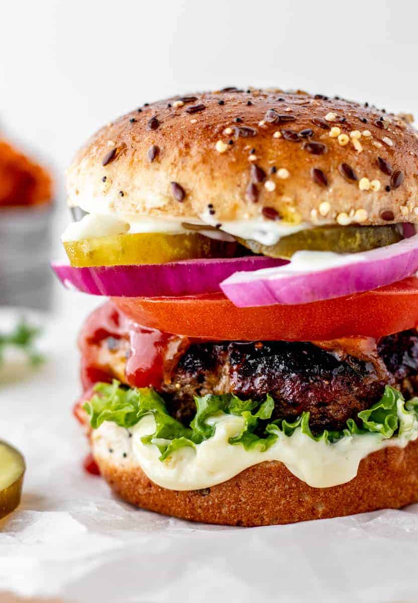 juicy burger with toppings and Worcestershire sauce.
