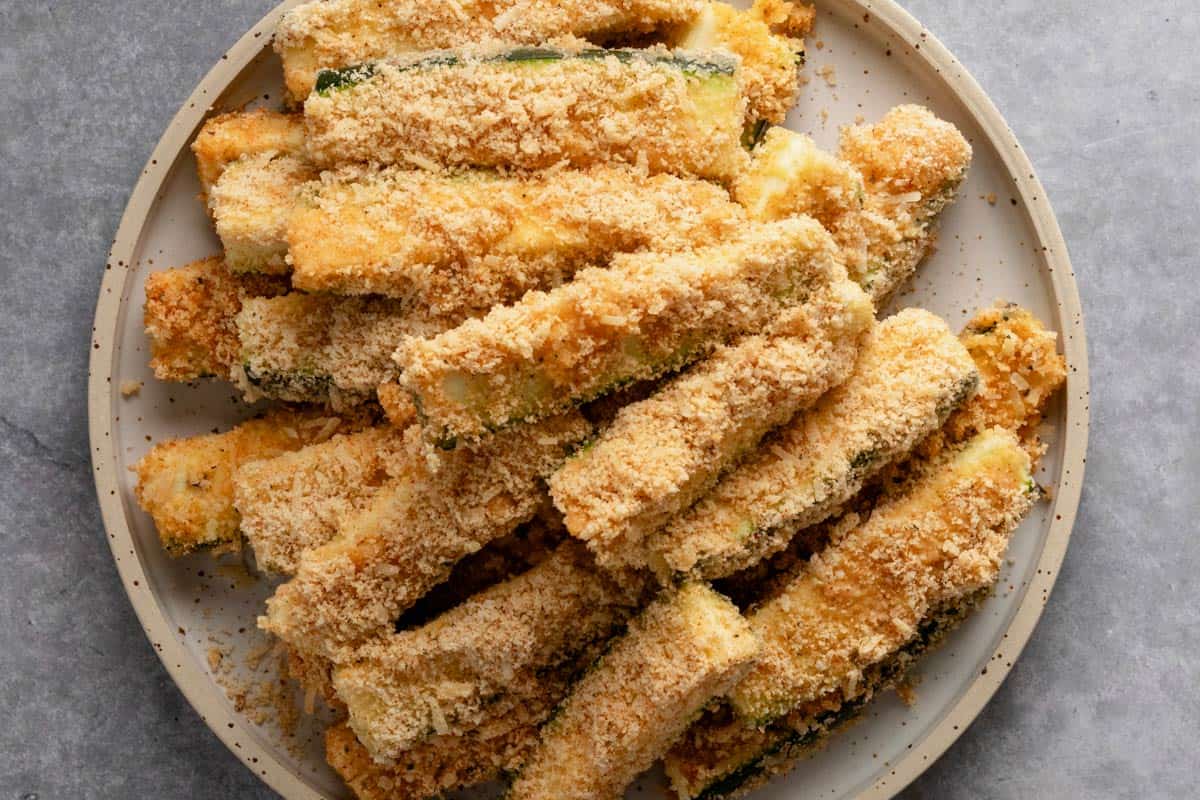 almond flour and parmesan breaded zucchini fries before roasting.