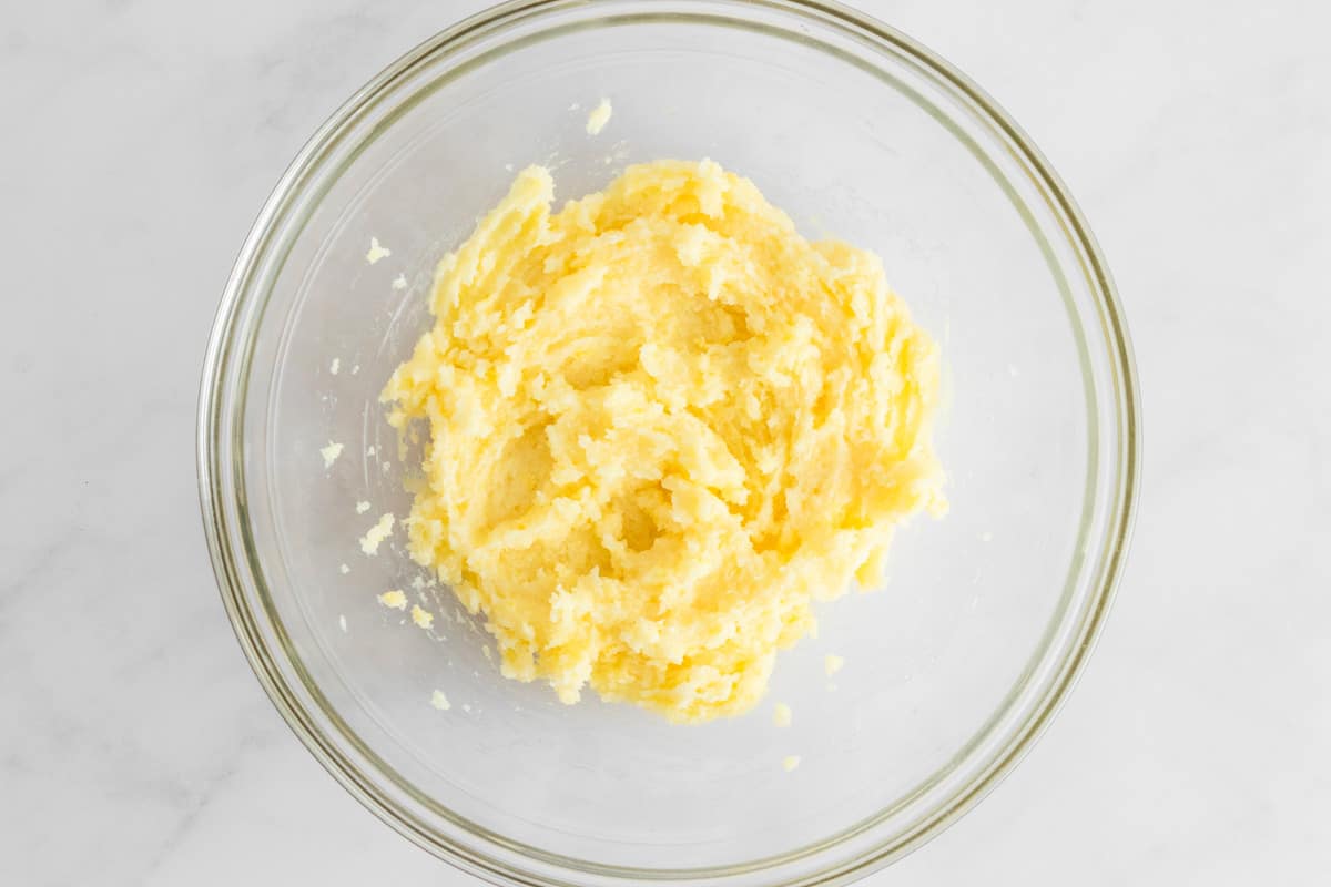sugar, butter and eggs beaten together in a bowl.