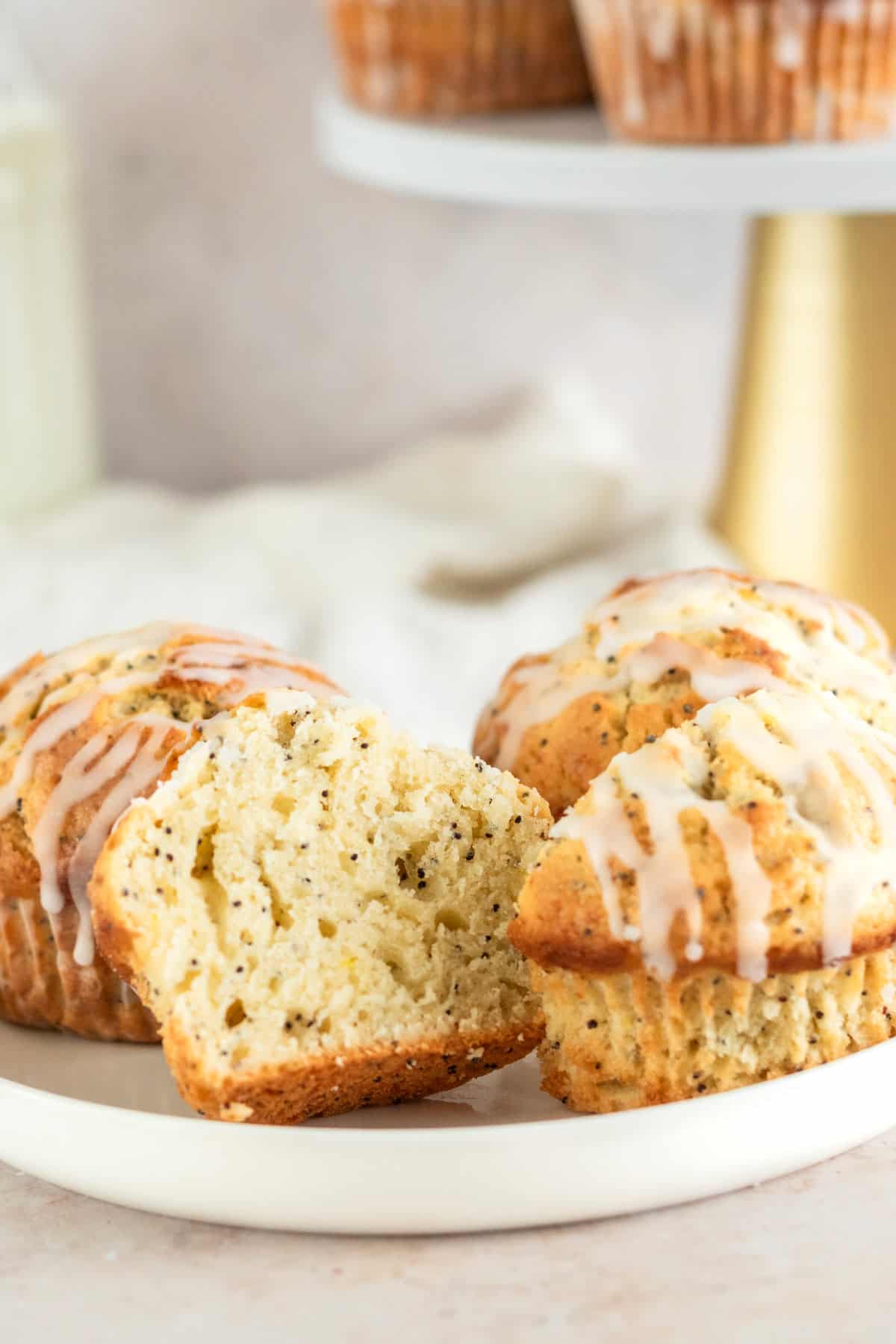 cut in half lemon poppy seed muffin with lemon icing.