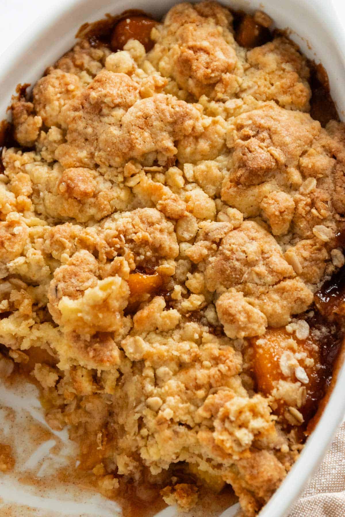 peach cobbler with golden brown topping.