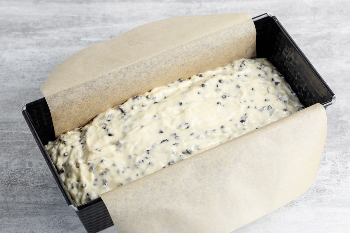 chocolate chip bread batter in a loaf pan before baking.
