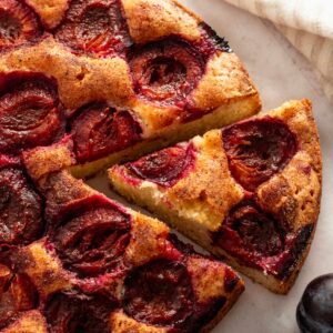 plum cake ith fresh plums on top.