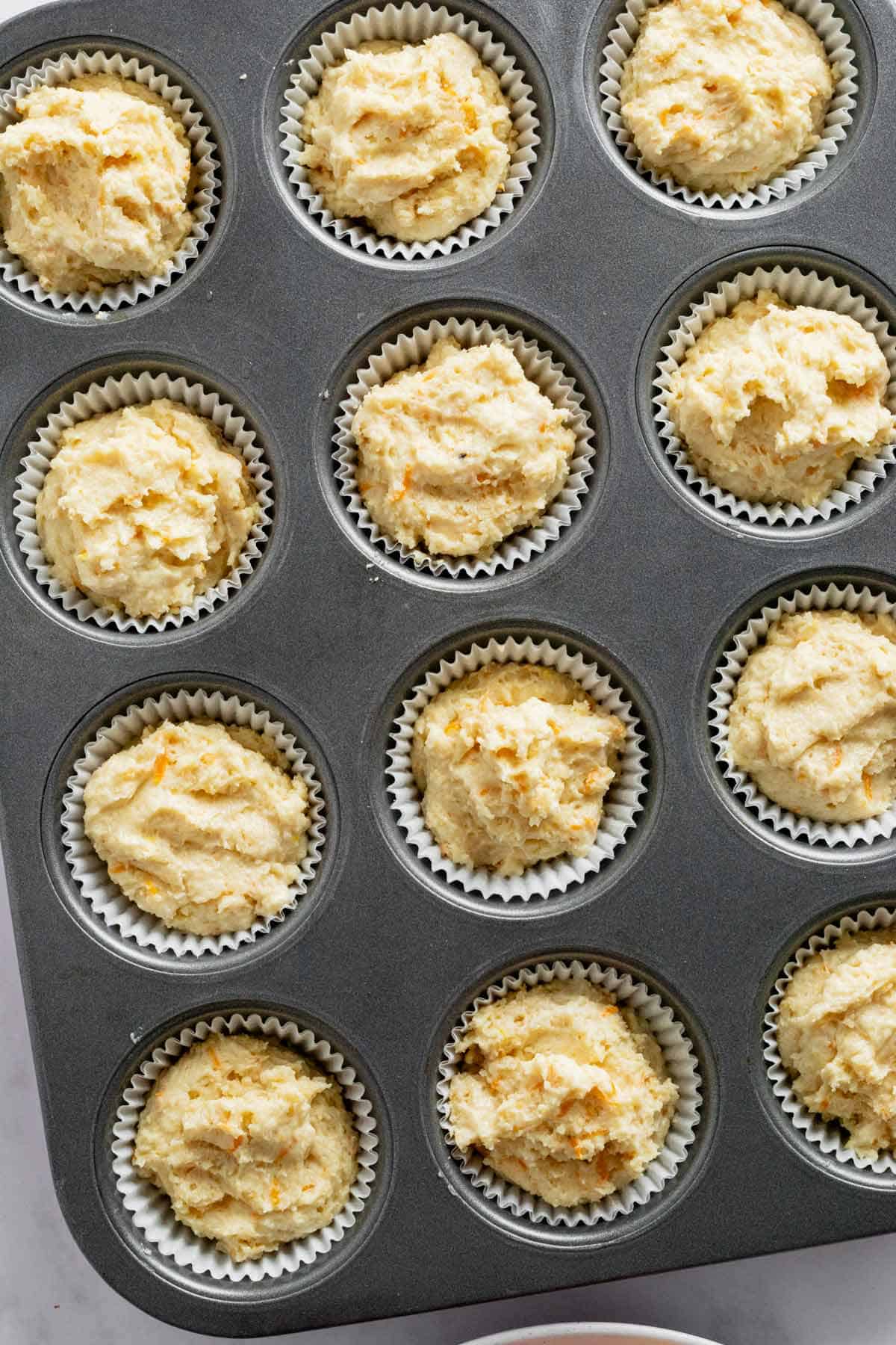 batter lined in muffin tins.