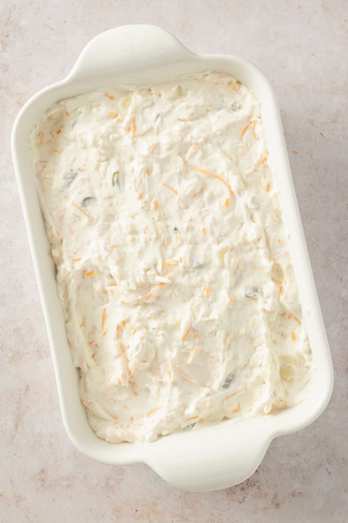 cream cheese dip added to baking sheet.