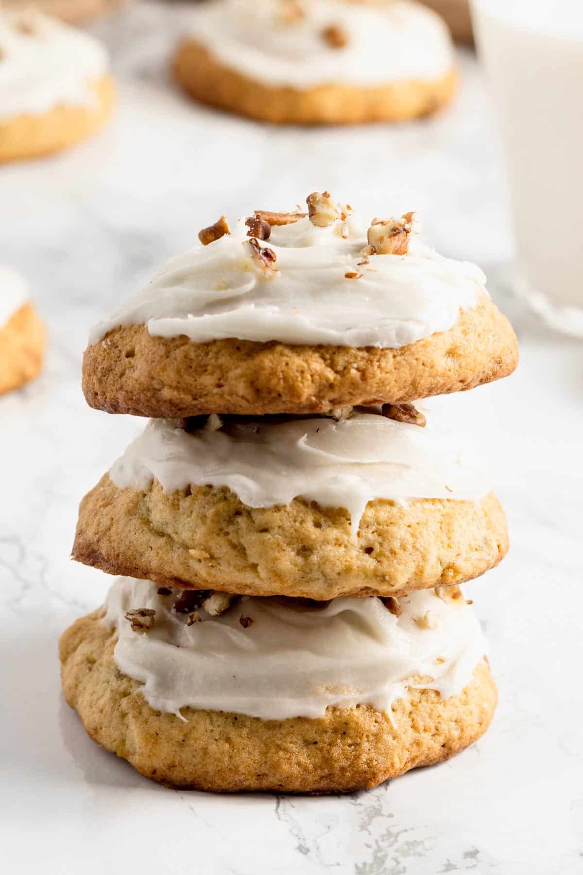 a stack of banana cookies with frosting.