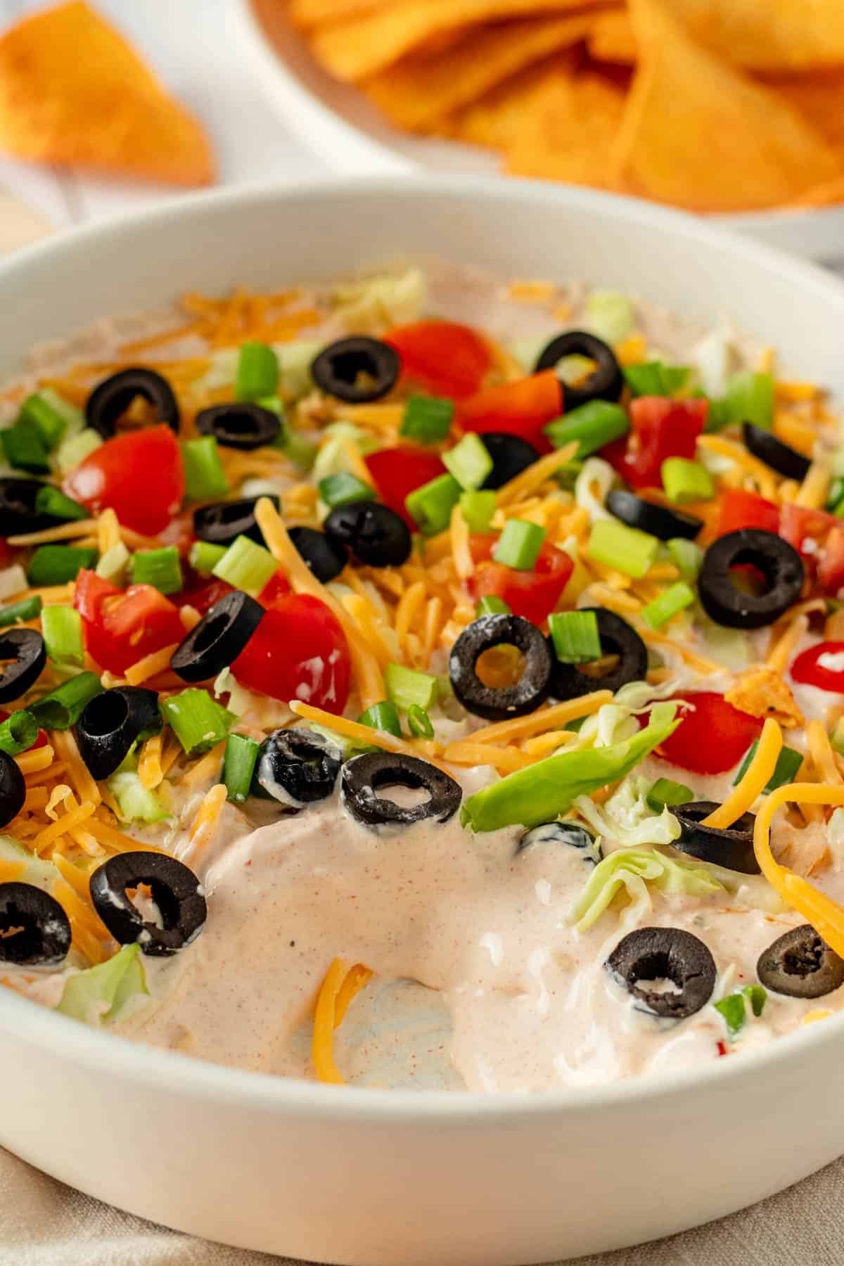 creamy taco dip with toppings.