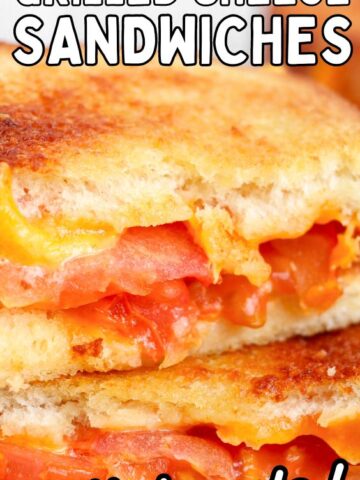 a stack of grilled cheese tomato sandwiches.