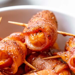 a bowl of ready to serve bacon wrapped smokies.
