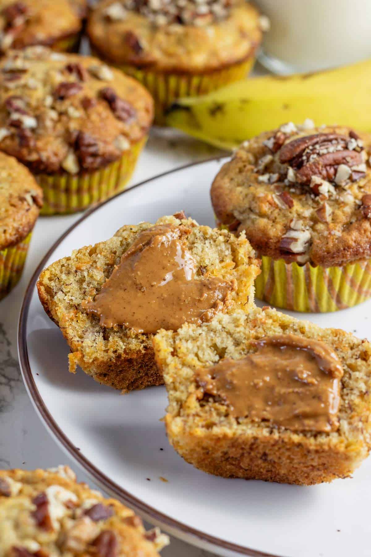 Carrot banana muffins with nuts and peanut butter spread.