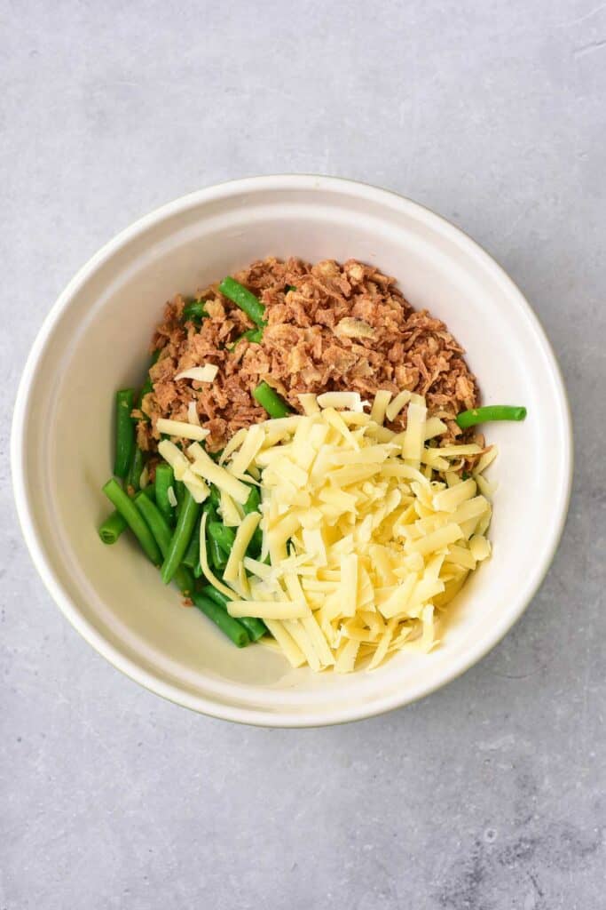 cheese, green beans and fried onions in a bowl.