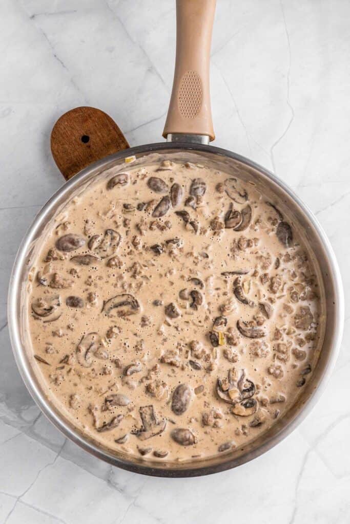 creamy mushrooms sauce in skillet.