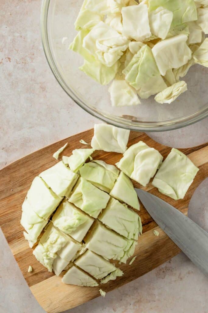 slicing the head of cabbage.