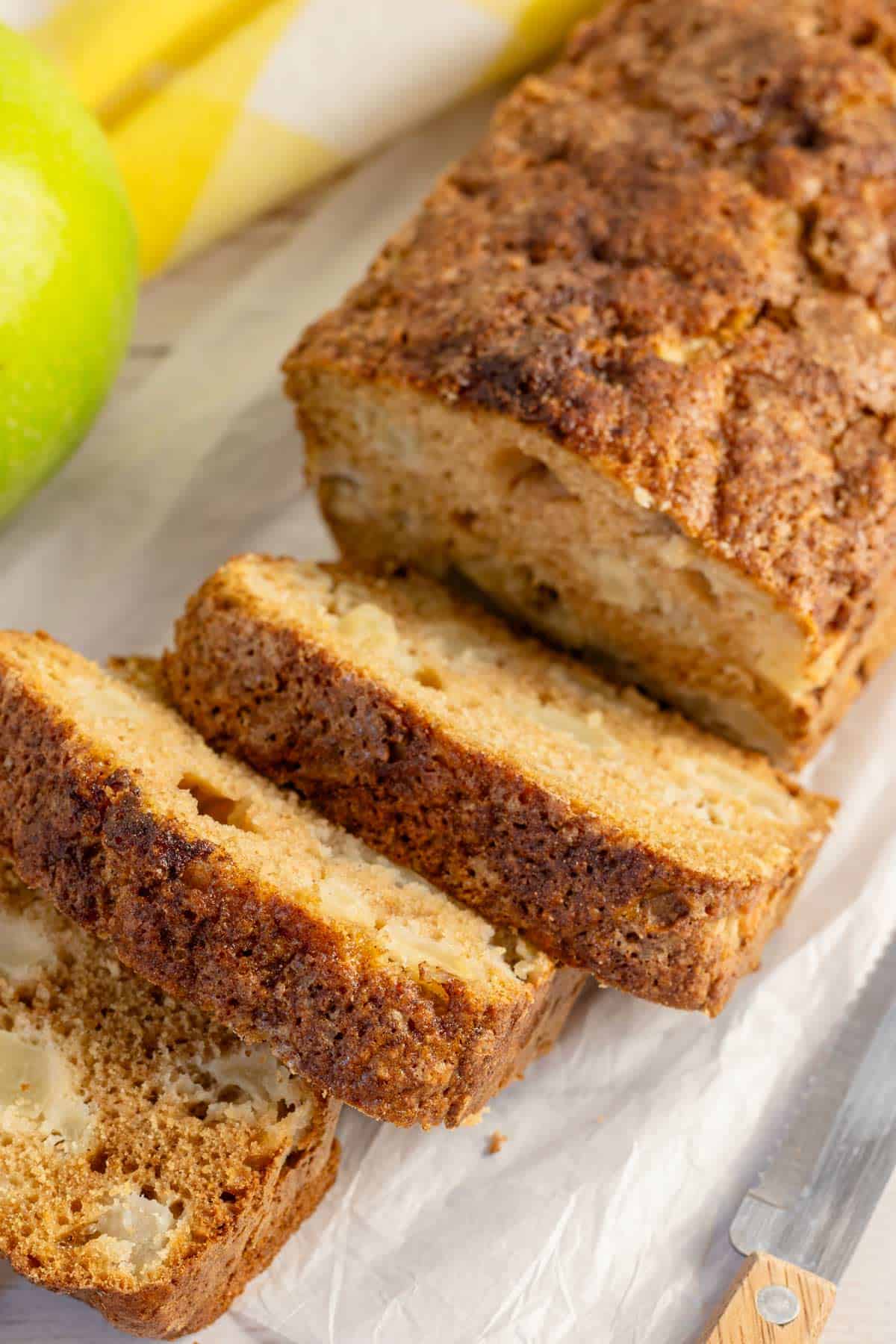 sliced apple bread with cinnamon and fresh apples.