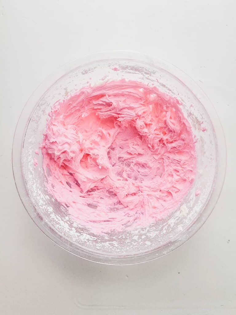 pink frosting in a bowl.