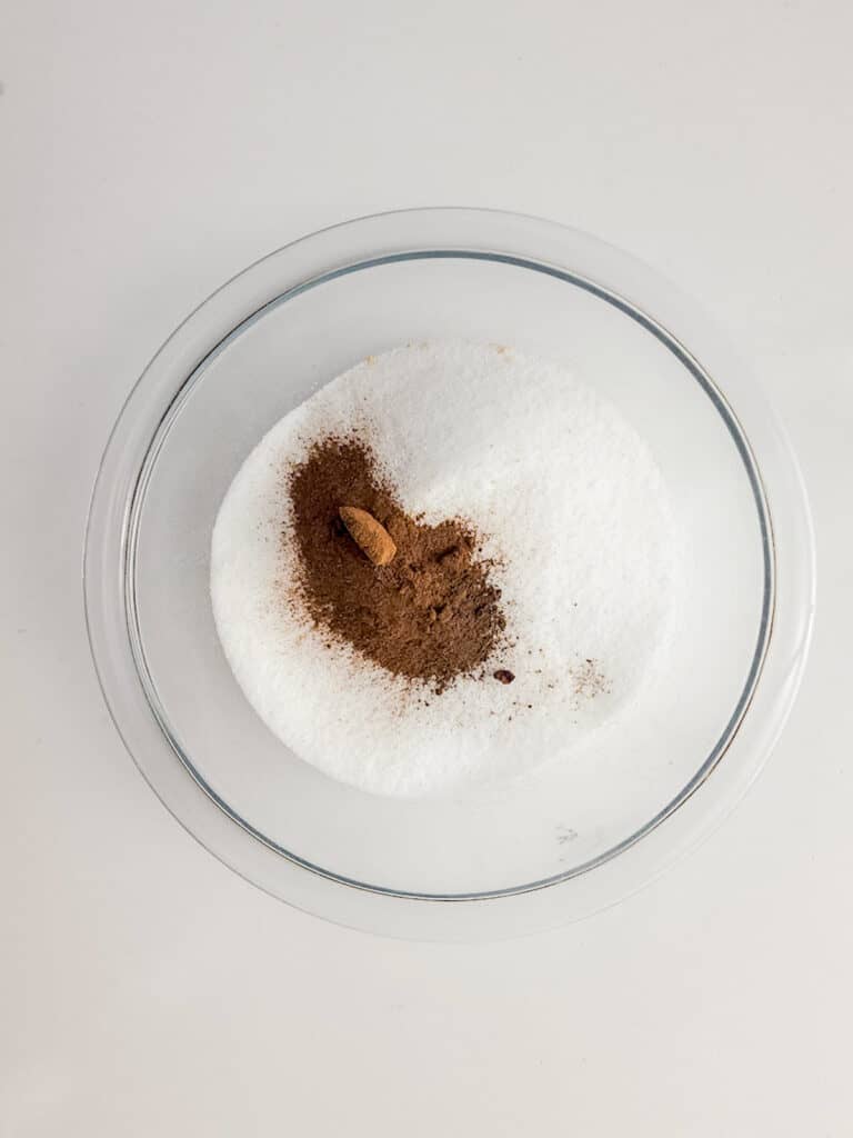 a bowl of white sugar and cinnamon.