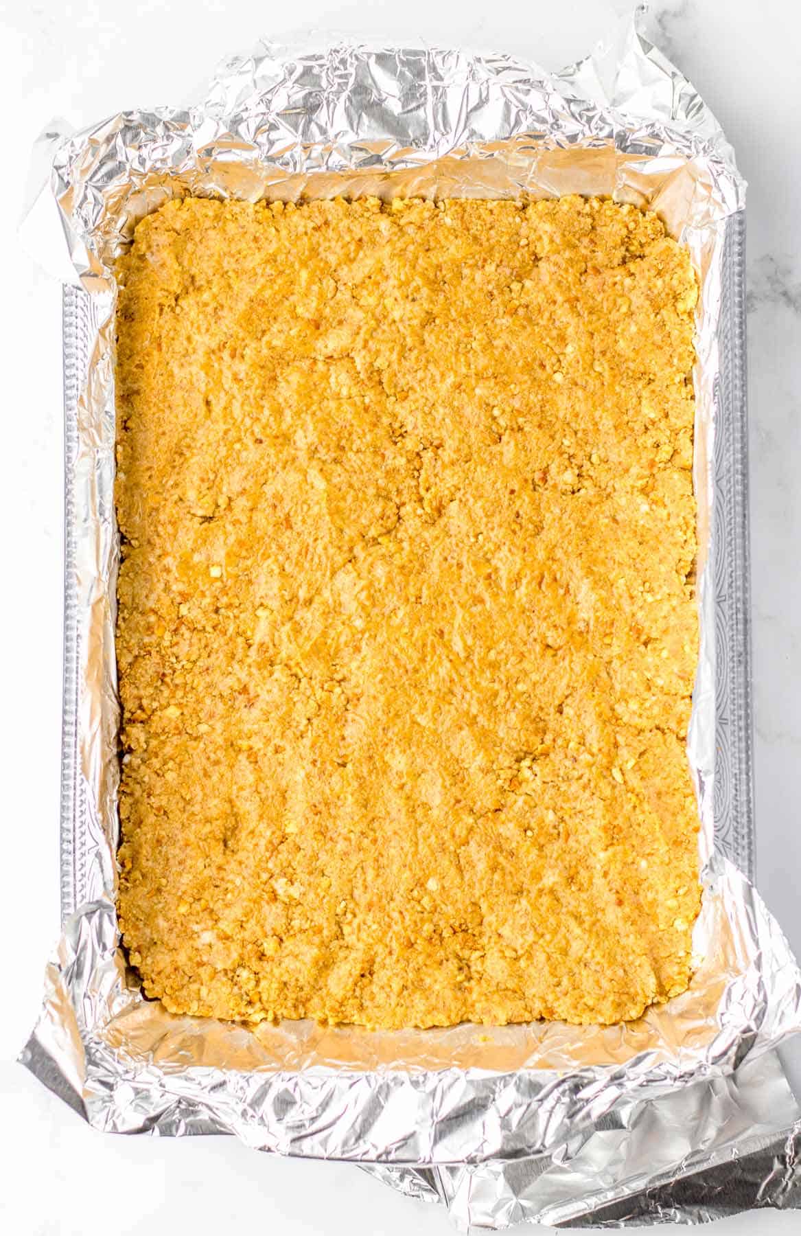 peanut butter mixture pressed into baking sheet.