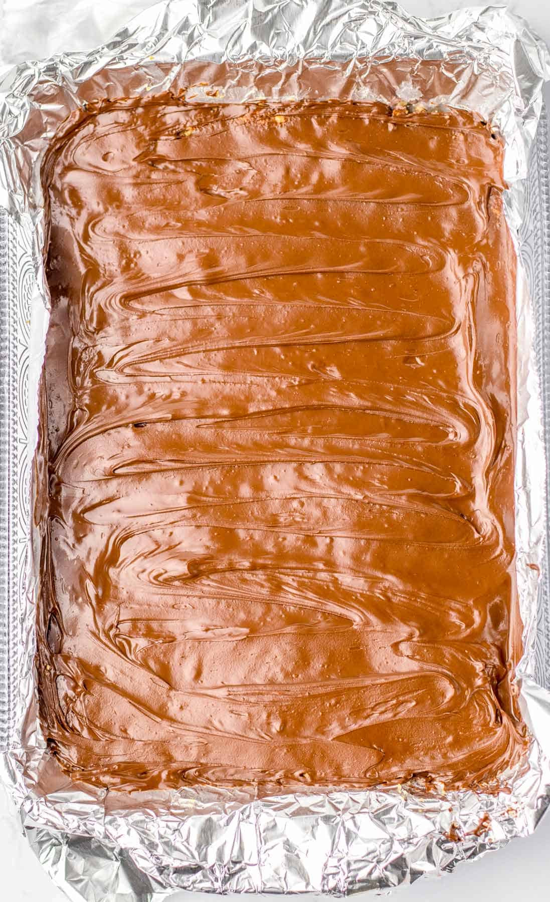 peanut butter mixture topped with melted chocolate mixture.