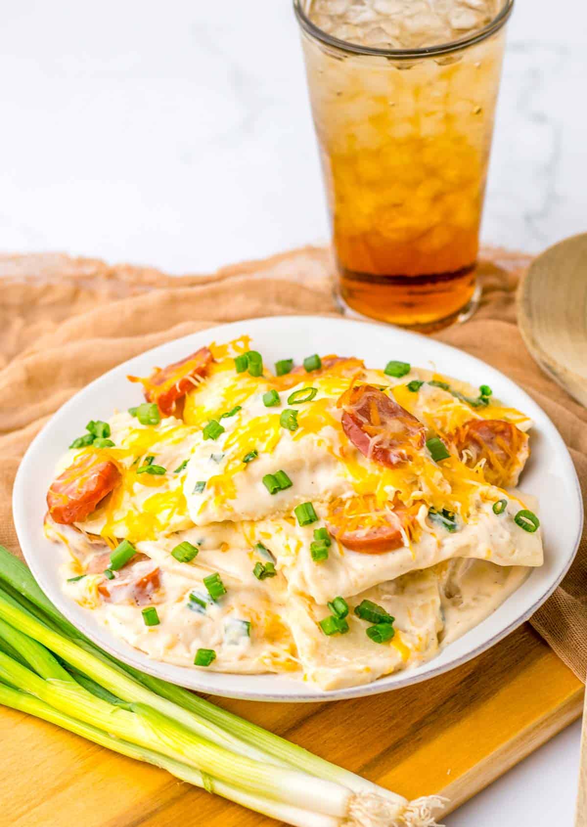 a plate of pierogi casserole with cheese.