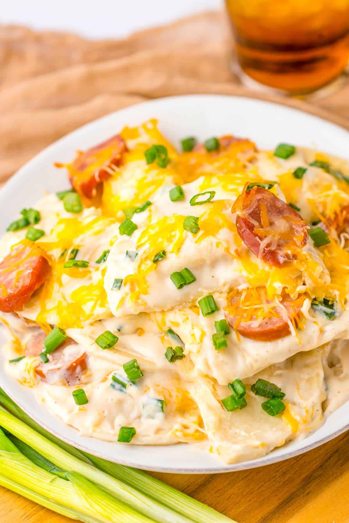 a plate of pierogi casserole with cheese.