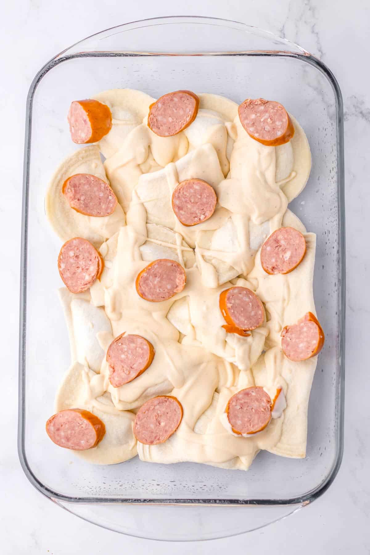 frozen pierogis topped with kielbasa slices.