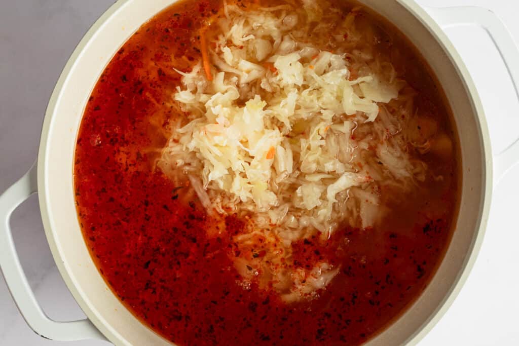 Sizzling sauerkraut soup in a pot