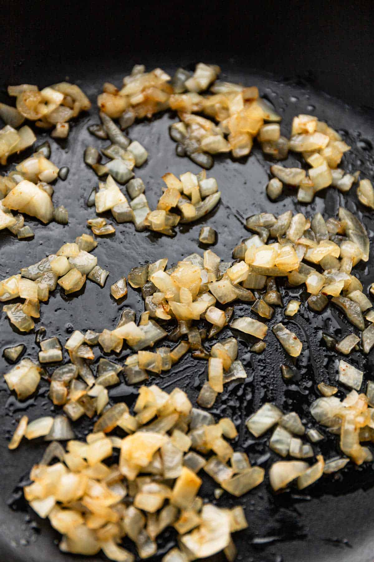 cooking onion in skillet.