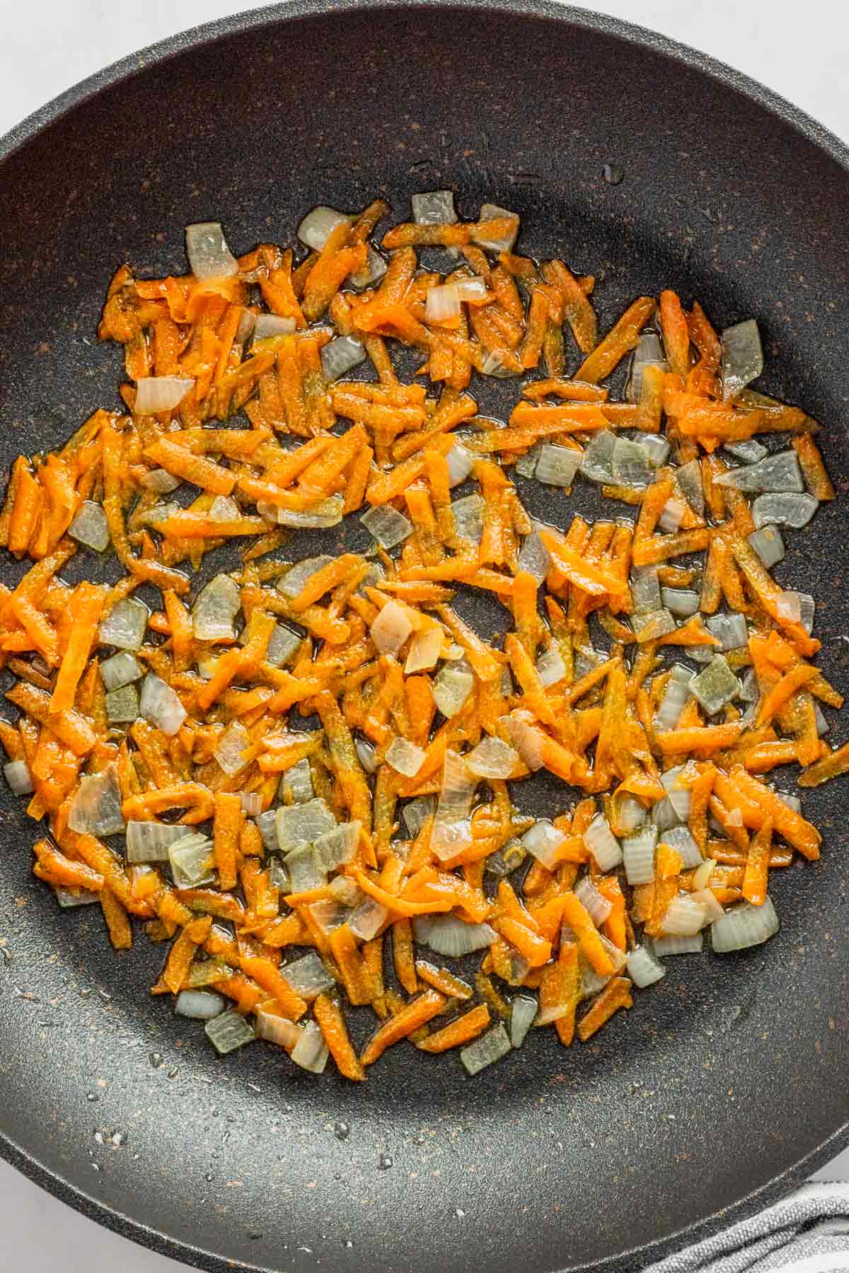 sauteeing carrots and onions.