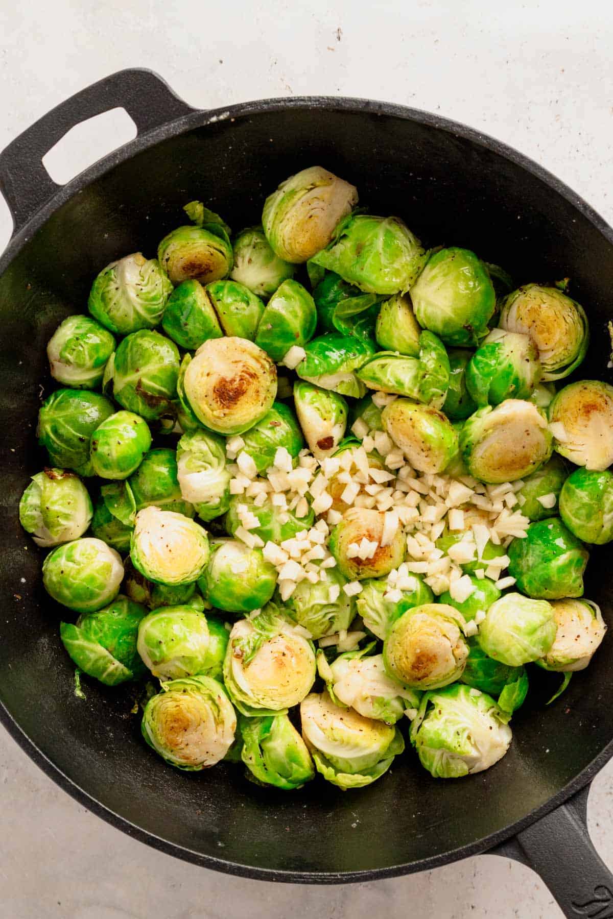 brussel sprouts in skillet with garlic.