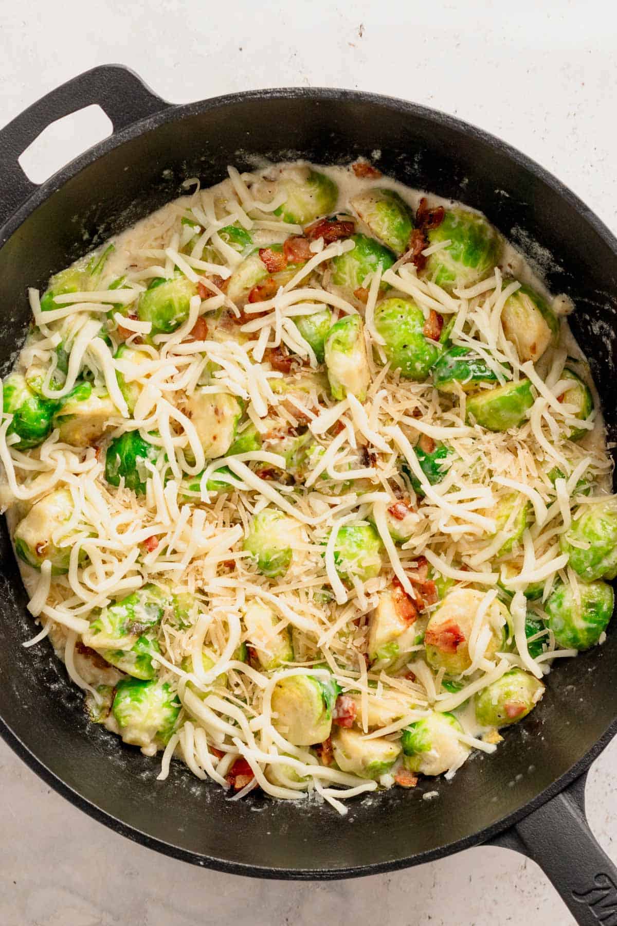 topping brussel sprouts with cheese.